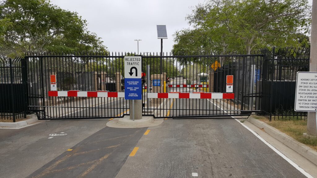 High Security Gate at military base with lights and reflective tape on gate panel.