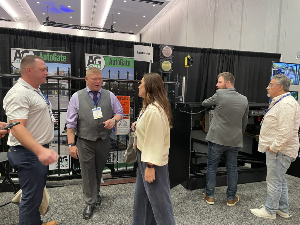 AutoGate Booth with team members and customers