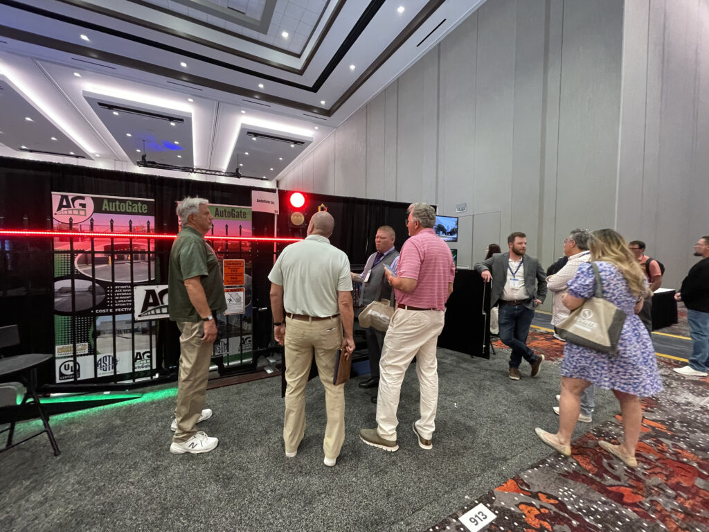 AutoGate Booth with team members and customers